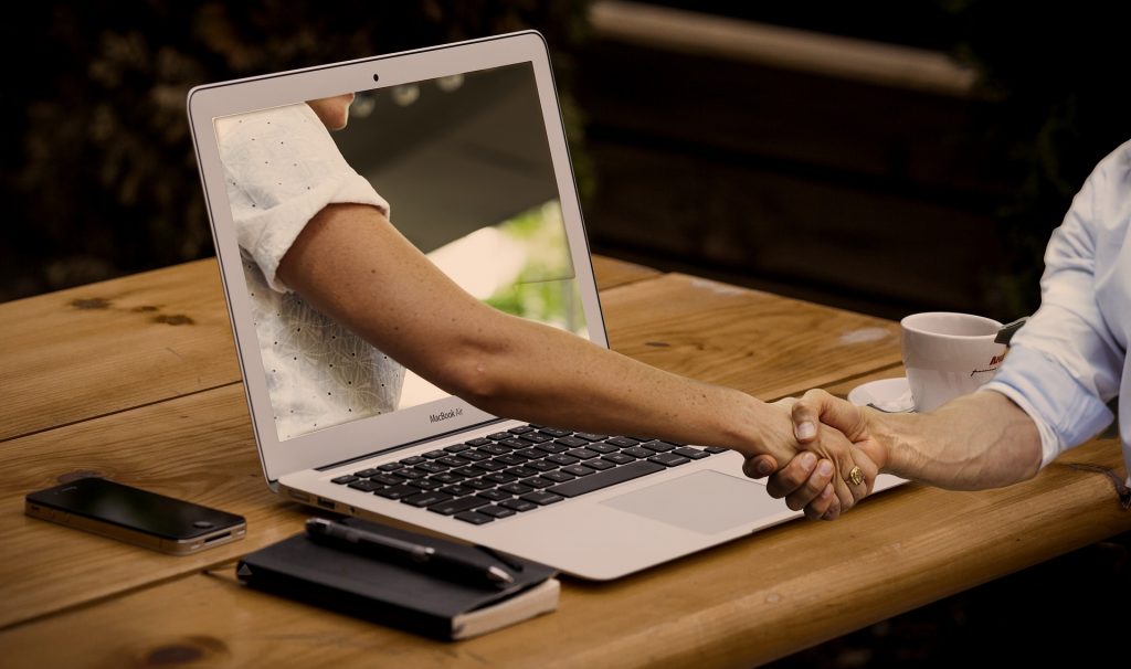 handshake through laptop